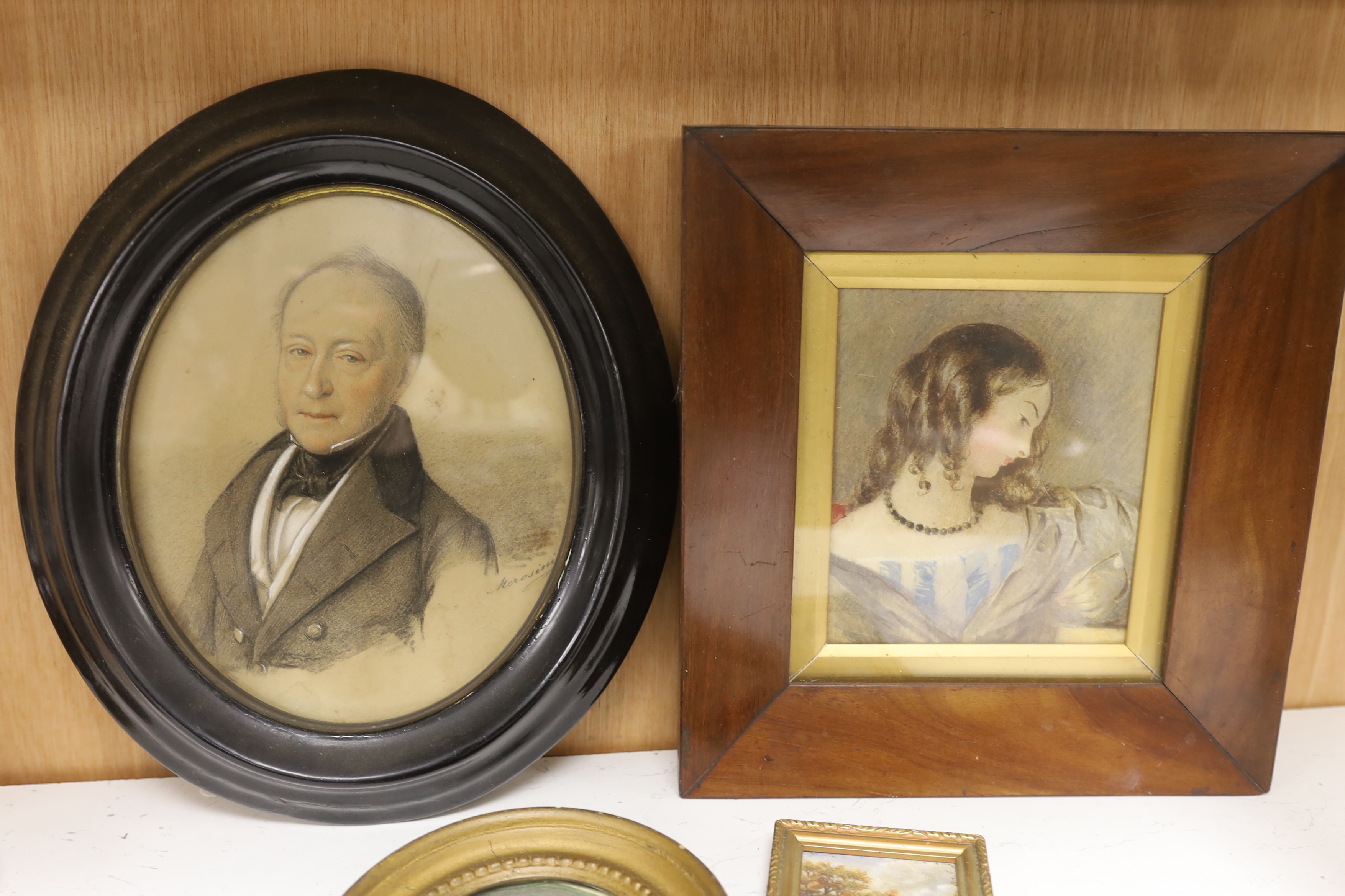 George Morosini (d.1882), heightened charcoal portrait of a gentleman, two 19th century watercolour portraits of children, one monogrammed GPH and dated 1800, and a miniature oil landscape, largest 19 x 15cm